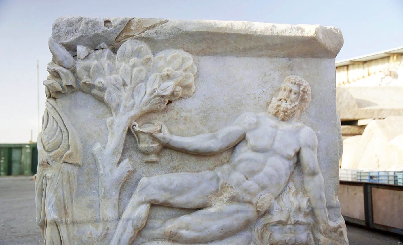 Remarkable 1,700-year-old coffin sculpture shows Hercules fighting the god of wine