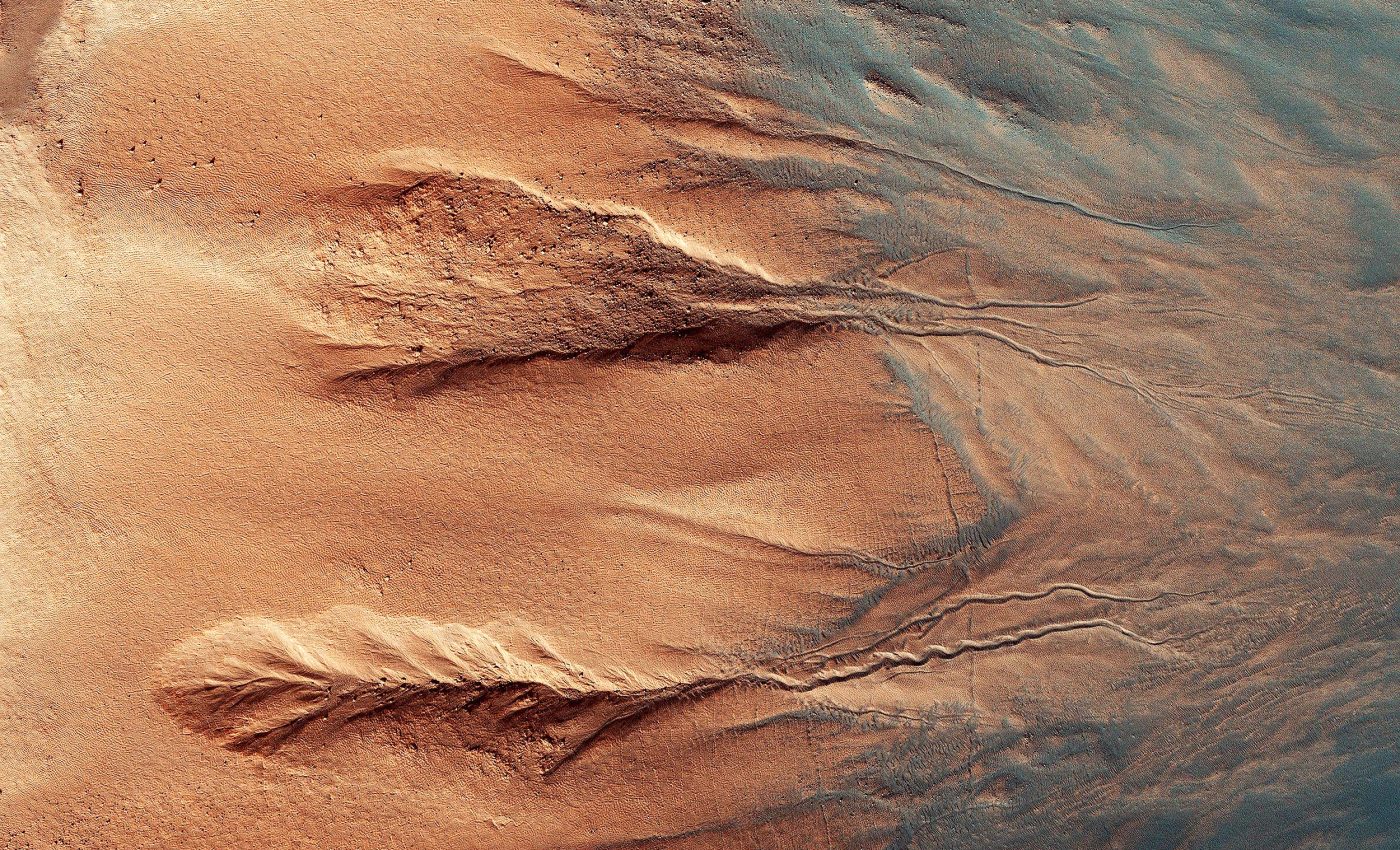 Mars is covered with gullies, but no one is sure what created them