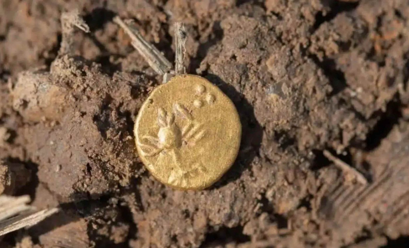 Archaeologists discover ancient hoard containing hundreds of gold and silver coins