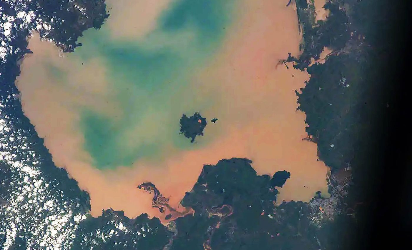 Astronaut finds sacred lake, containing relics and mummies, has turned from blue to toxic green